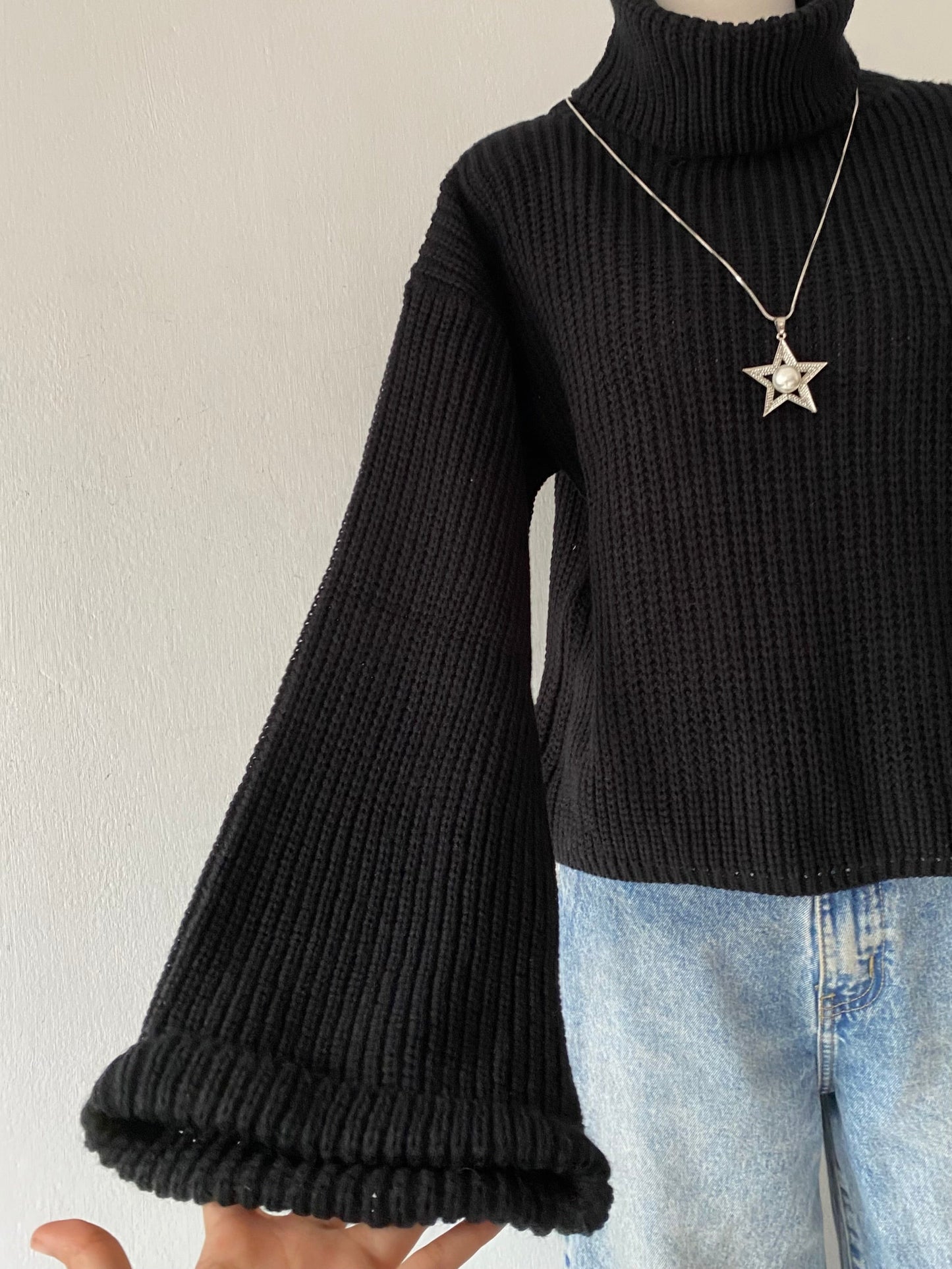 High-neck sweater with wide sleeves