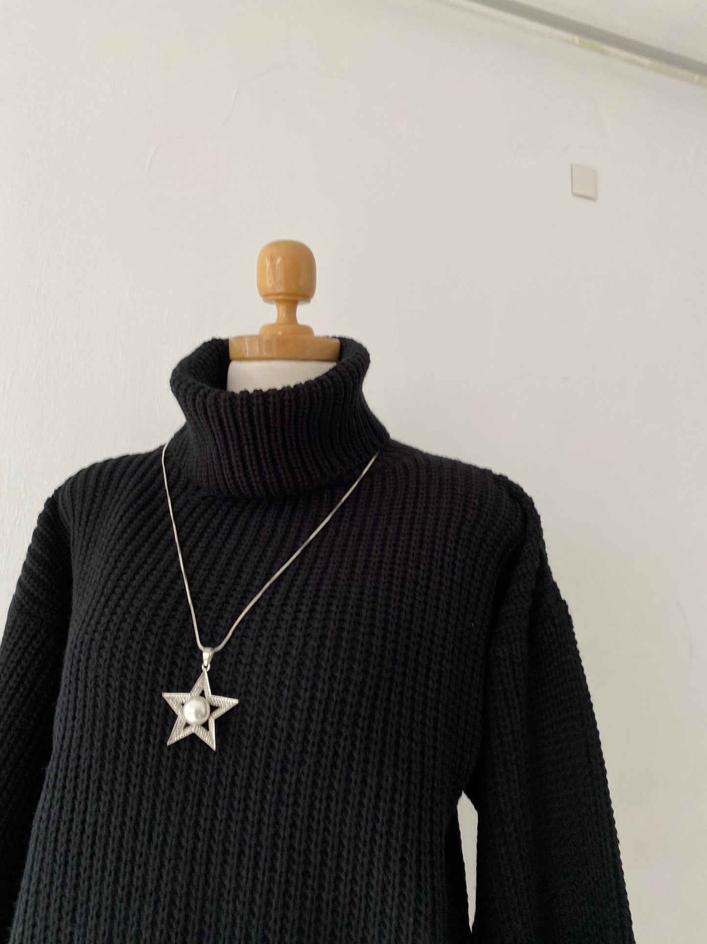 High-neck sweater with wide sleeves