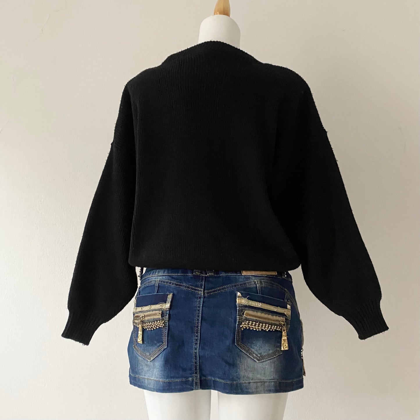 black sweater with animal print appliqués