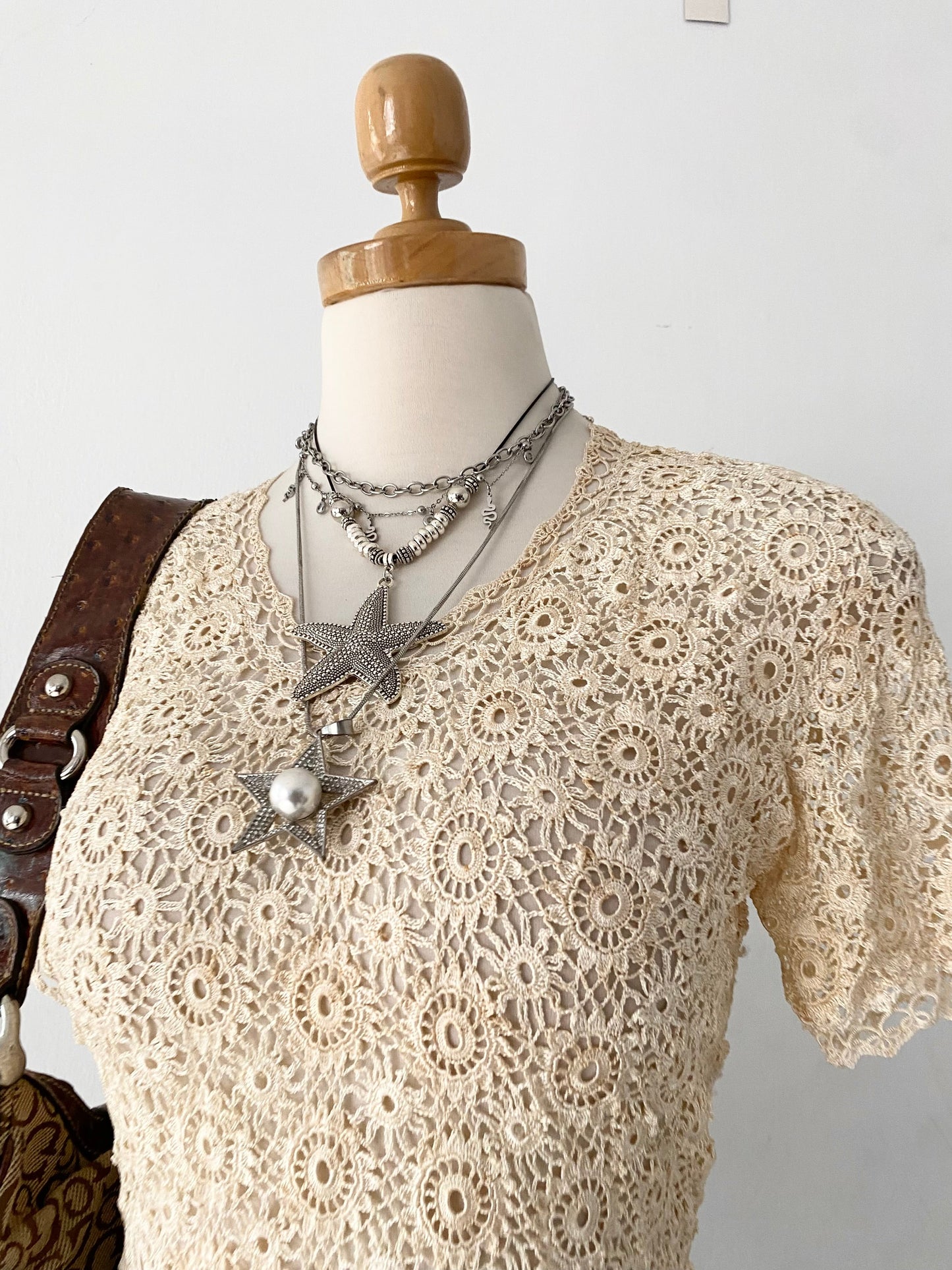 Knitted macrame top with back bow