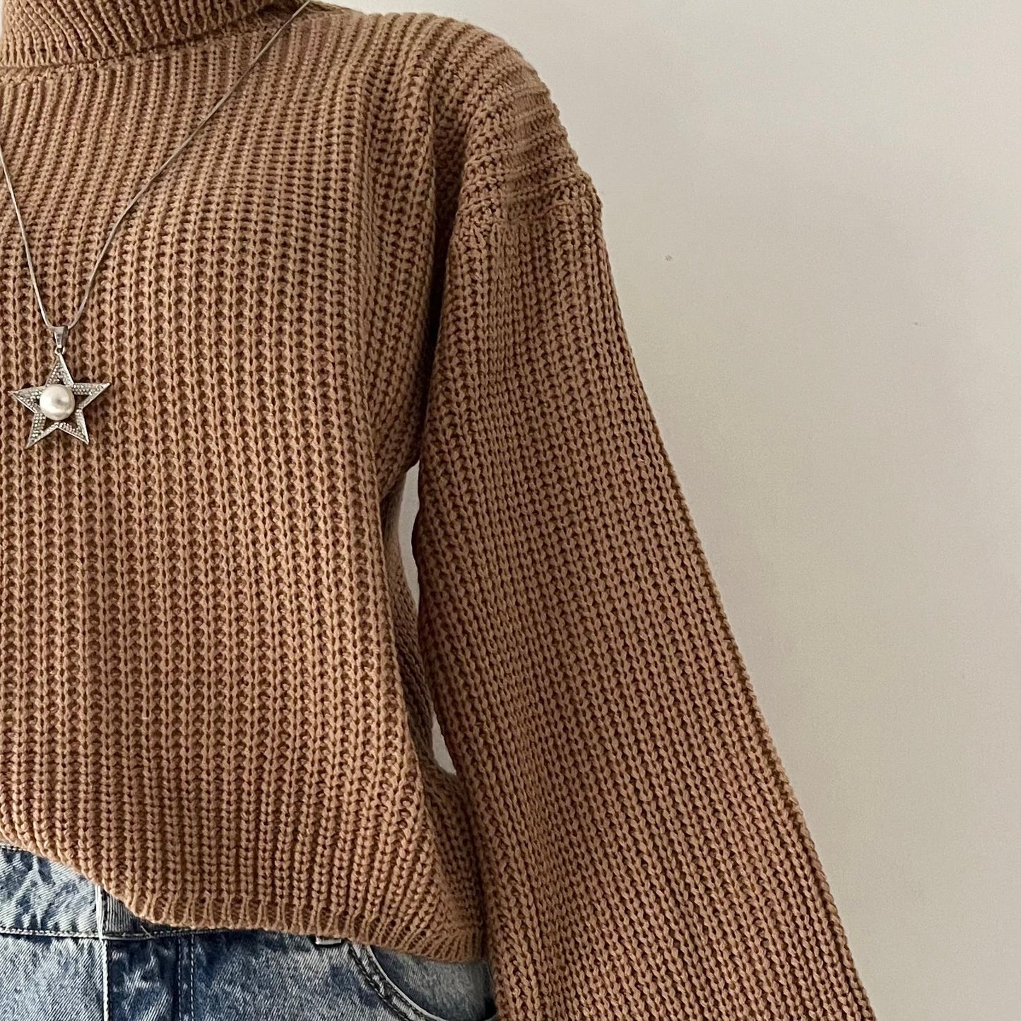 high-neck sweater with wide sleeves