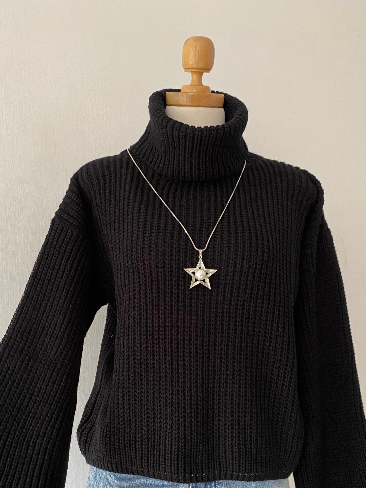 High-neck sweater with wide sleeves