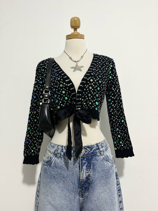 Knitted cardigan with sequins and bow